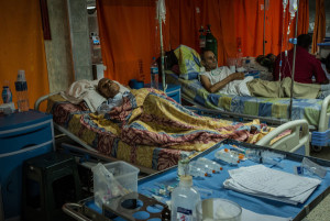 Patients rested in the hallways at the public hospital in Merida. Across Venezuela, public hospitals are short on supplies and have long waiting lists for beds. Credit Meridith Kohut for The New York Times
